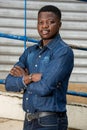 Young businessman standing back to the wall and iron bar Royalty Free Stock Photo