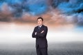 Young businessman standing crossarmed Royalty Free Stock Photo