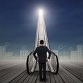 Young businessman standing at the escalator