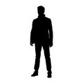 Young businessman standing in suit, isolated vector silhouette Royalty Free Stock Photo