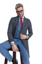 Young businessman with style is adjusting his coat Royalty Free Stock Photo