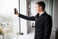 young businessman in a stylish modern office space with large wind Royalty Free Stock Photo