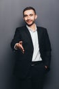 Young businessman in suit give hand shake Royalty Free Stock Photo