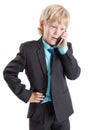 Young businessman in suit talking with mobile phone, isolated white background Royalty Free Stock Photo