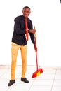 Young businessman sweeps the desk smiling