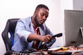 Young businessman takes the telephone receiver in the office Royalty Free Stock Photo