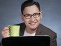 Young Businessman Taking Coffee Break at the Office Royalty Free Stock Photo