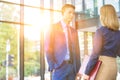 Young businessman talking with businesswoman in office during meeting Royalty Free Stock Photo