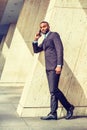 Young Businessman talking on cell phone outside in New York Royalty Free Stock Photo