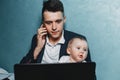 Businessman working at home watching baby daughter Royalty Free Stock Photo