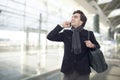 Young businessman talking on mobile phone in airport Royalty Free Stock Photo