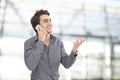 Young businessman talking mobile phone in the office Royalty Free Stock Photo