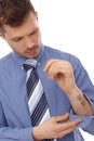 Young businessman with tattoo in forearm