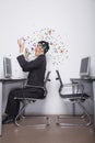 Young Businessman throwing confetti in the office Royalty Free Stock Photo
