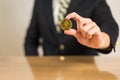 Trader sitting in front of wooden desk