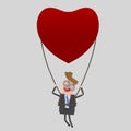 Young businessman traveling in a heart balloon