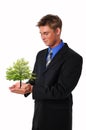 Young businessman with tree