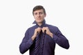 Young businessman try to tie one's tie on white background Royalty Free Stock Photo