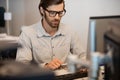 Young businessman typing on computer keyboard in office Royalty Free Stock Photo