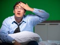 Young businessman under stress in the bedroom at night Royalty Free Stock Photo