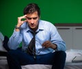 Young businessman under stress in the bedroom at night Royalty Free Stock Photo