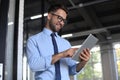 Young businessman using his tablet in the office Royalty Free Stock Photo