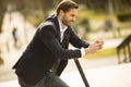 Young businessman using mobile phone  on electric scooter Royalty Free Stock Photo