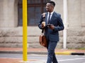 Cross the street safely. a young businessman using a phone in the city. Royalty Free Stock Photo