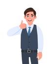 Young businessman in waistcoat showing thumb up gesture. Person making symbol of like, agree or good sign. Male character design. Royalty Free Stock Photo