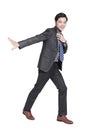 Young businessman walking and smiling isolated over white background Royalty Free Stock Photo