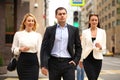 A young businessman walking on the street with their secretaries Royalty Free Stock Photo