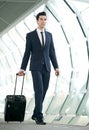 Young businessman walking in subway station with bag Royalty Free Stock Photo