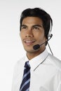 Young businessman wearing headset. Conceptual image Royalty Free Stock Photo