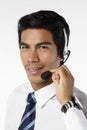 Young businessman wearing headset. Conceptual image Royalty Free Stock Photo