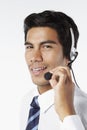 Young businessman wearing headset. Conceptual image Royalty Free Stock Photo