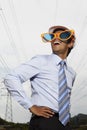 Young businessman wearing oversized sunglasses. Conceptual image