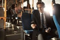 Young businessman listening to music on his morning commute Royalty Free Stock Photo