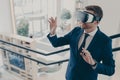 Young businessman wearing virtual reality goggles working in office Royalty Free Stock Photo