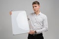 Portrait of young man with clean magnetic Board in his hands isolated on white background