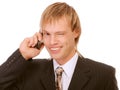 Young businessman winks and speaks by phone Royalty Free Stock Photo