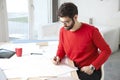 Young businessman working in architect studio Royalty Free Stock Photo