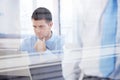 Young businessman working in bright office