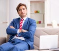 Young businessman working at home sitting on the sofa Royalty Free Stock Photo