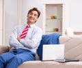 Young businessman working at home sitting on the sofa Royalty Free Stock Photo