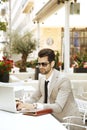 Young businessman working on laptop