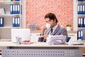 The young businessman working in the office Royalty Free Stock Photo