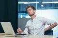 Young businessman working in the office, tired has back pain Royalty Free Stock Photo