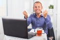 Young businessman working in the office, very concerned, in a panic, crumpled paper. Royalty Free Stock Photo