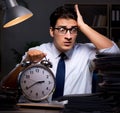 Young businessman working overtime late in office Royalty Free Stock Photo