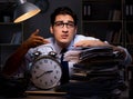 Young businessman working overtime late in office Royalty Free Stock Photo